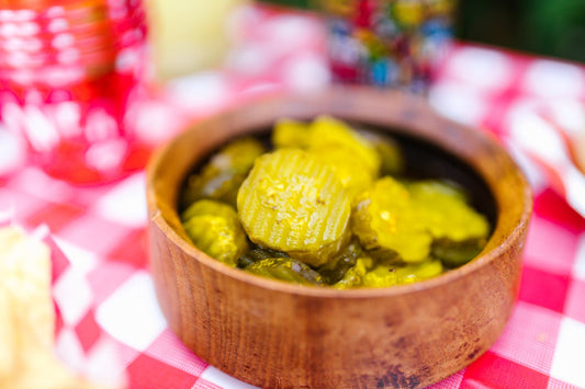 Sliced crinkle-cut burger pickles in bowl