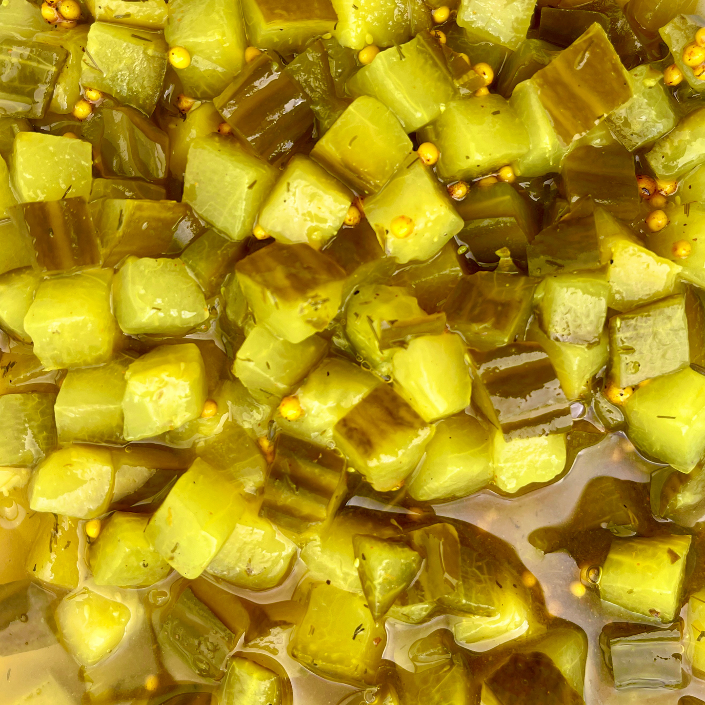 Close-up of chopped pickled organic gherkins